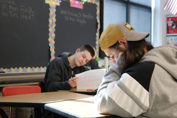 Courageous character: Sophomores Dominic Severin (left) and Alexander Micon (right) sit across from each other as they take a vocabulary test in their Honors English 10 course.