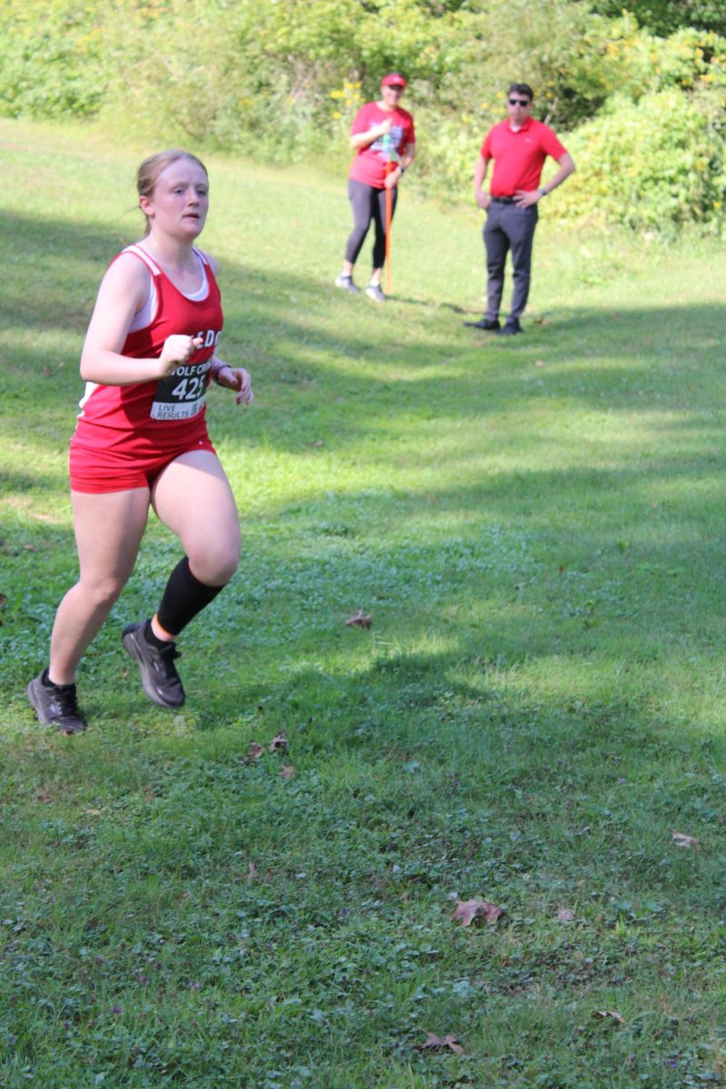 Crossing the finish line: Hannah Shaffer (11) pushes herself to the finish line after a challenging race at Brush Creek Park. At this race, Shaffer placed 46th in the female bracket. 