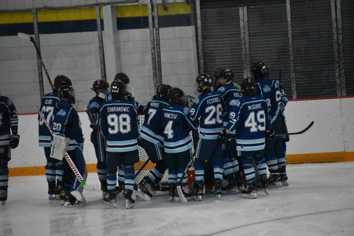 Rallying up: Huddling up just before a game, the Warriors rally up to continue their strong momentum. Communication and game plan is an important aspect of ice hockey.
