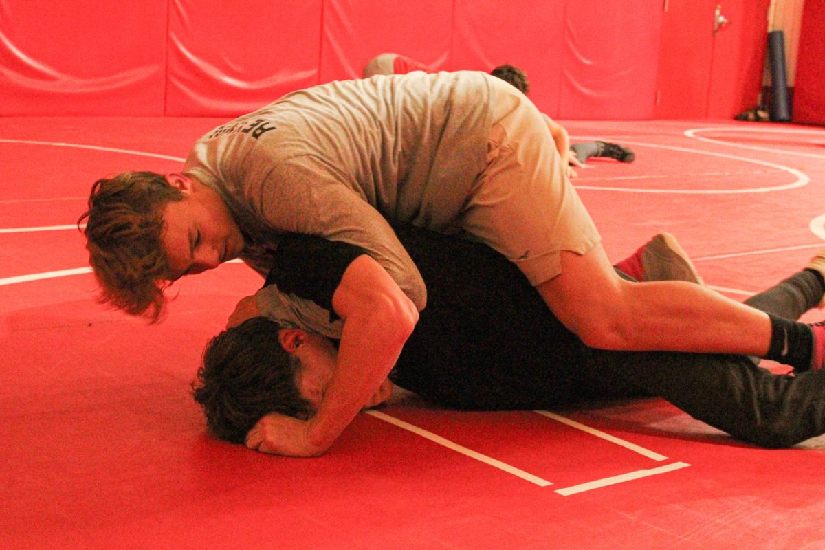 Practice makes perfect: During practice on Nov. 19, Brayden Reynolds (10) performs a wrestling move known as a ‘half-nelson’ on Elias Boyd (12).