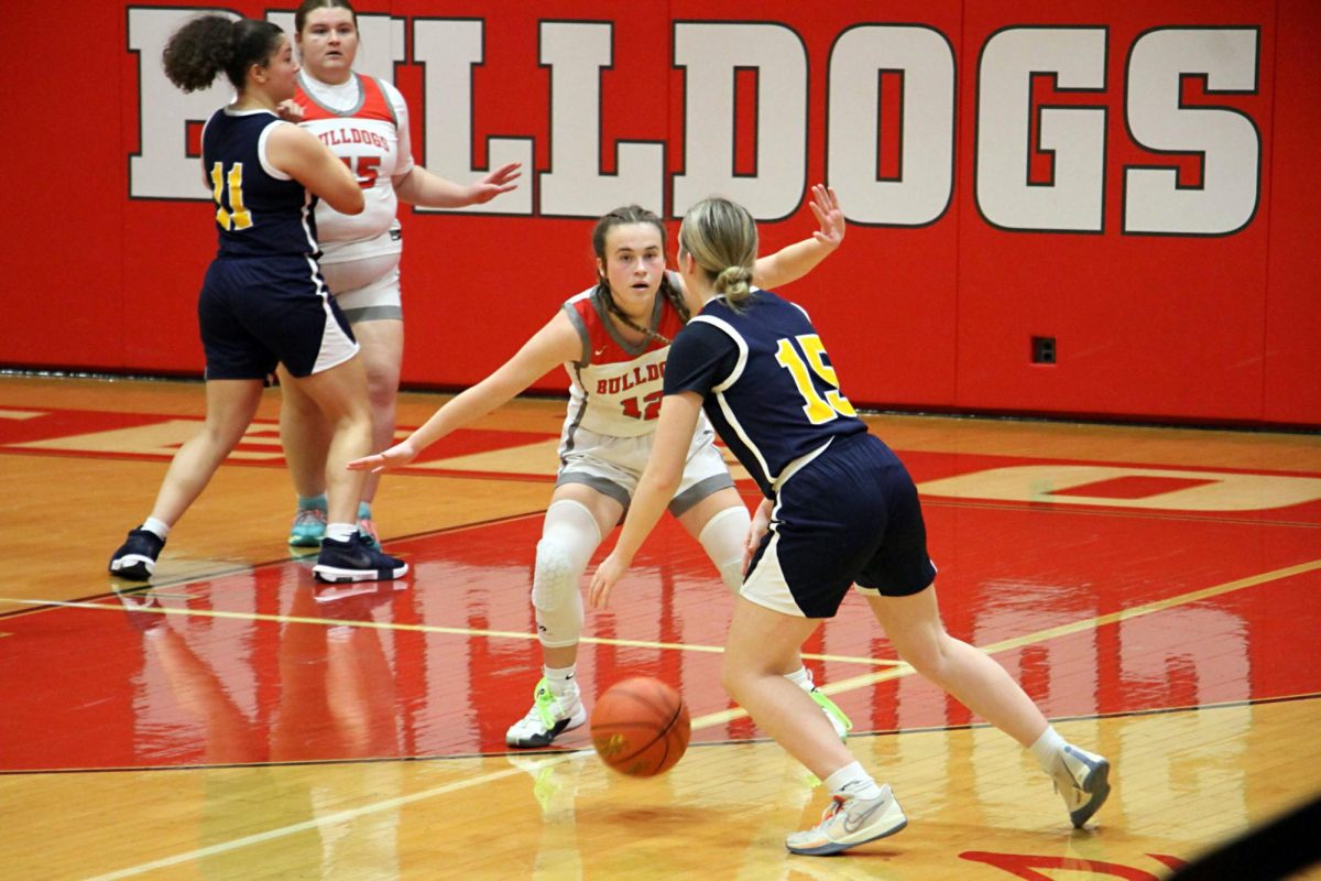  Getting into a defensive stance, Mackenzie Mohrbacher (11) prepares to take the ball from the offender. Mohrbacher was playing man-to-man defense, meaning each defender would play defense on one of the Shenango players at a time.