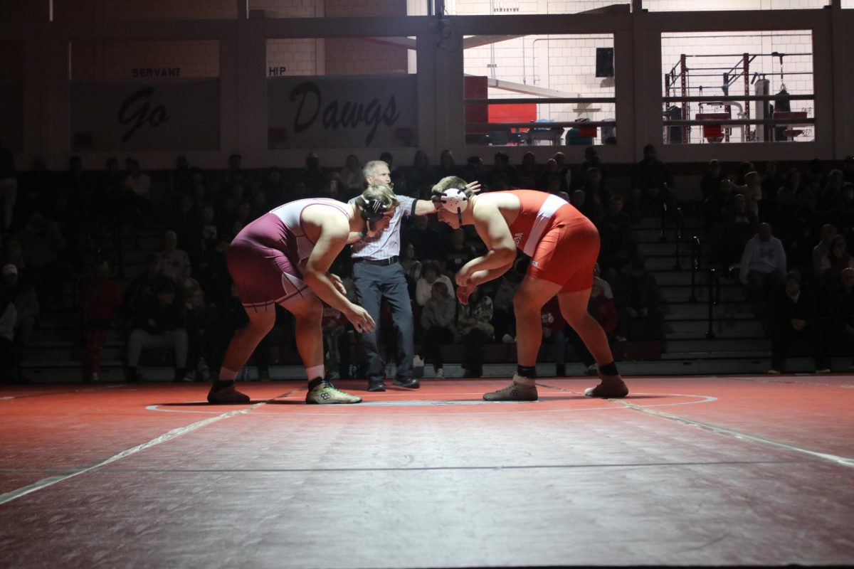 Matched up: Facing his opponent, Troy Gorajewski (10), prepares to start his match viciously on Jan. 15.
Beginning a wrestling match with a good set-up and a prepared mind is crucial for wrestling exceptionally.