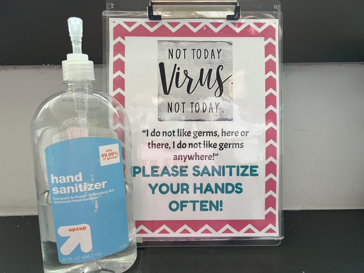 Stopping the spread: In the front of her classroom, Mrs. Maria Porter has a sanitizing station for students. During the COVID-19 pandemic, Porter wiped down the desks in her room daily to stop the spread.